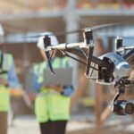 drone with camera flying at construction site