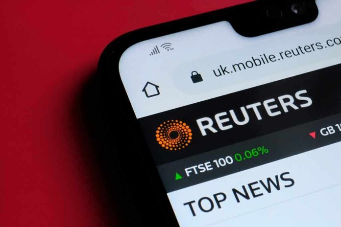 Smartphone displaying Reuters mobile website