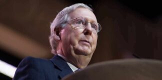 No-Show Senator – Silence From Rehab Freezes Floor Action elderly man in suit speaking at a podium
