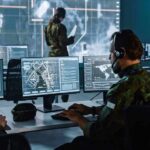 Satellite Proof: U.S. Hubs Took Hits Military analysts at computers in a command center