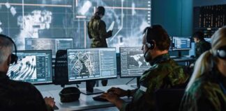 Satellite Proof: U.S. Hubs Took Hits Military analysts at computers in a command center
