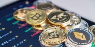 Stunning Defection Sinks Trump Crypto Overhaul Stack of cryptocurrency coins on a trading app screen