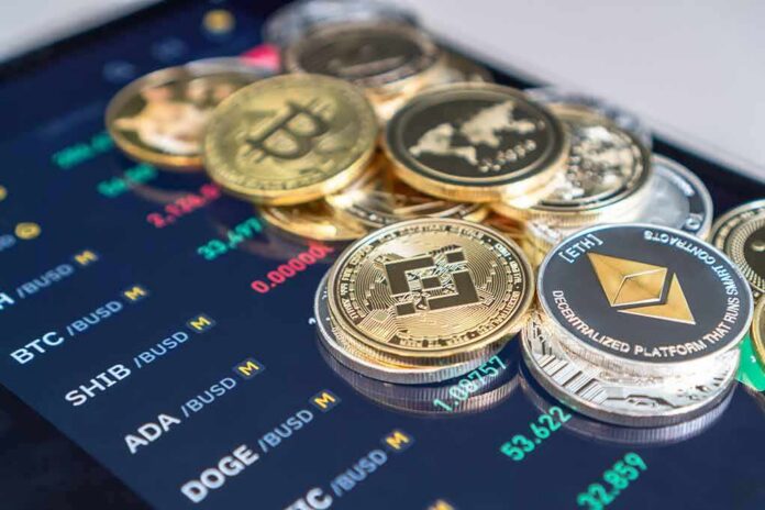 shutterstock_2002007354 Stack of cryptocurrency coins on a trading app screen