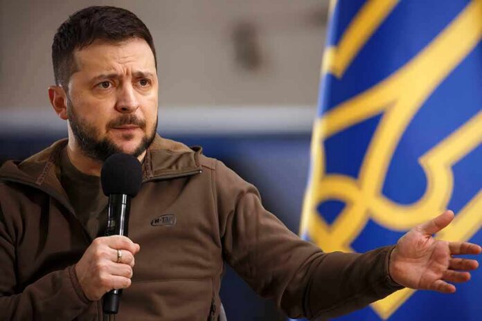 man speaking into a microphone with hand gesturing