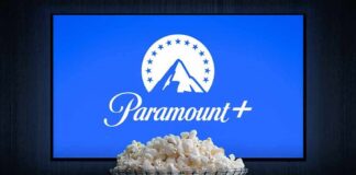 Glass bowl of popcorn in front of Paramount+ on TV