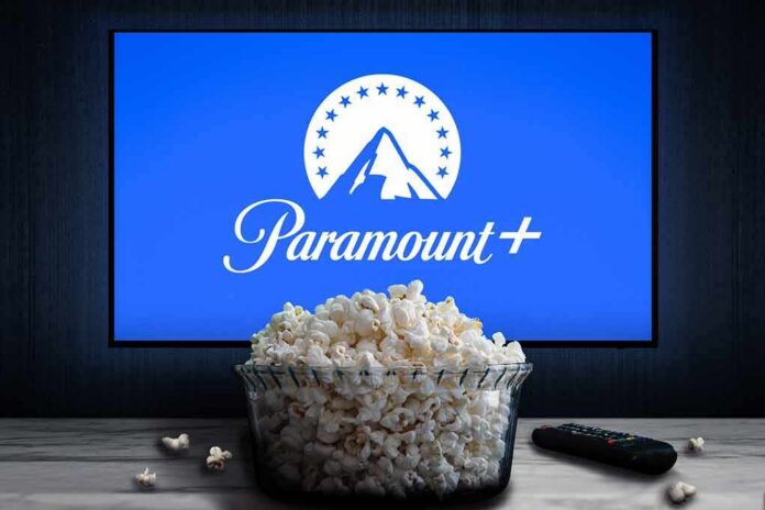 Glass bowl of popcorn in front of Paramount+ on TV