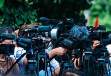 Flying Cars Hype—But Where’s The Commute? TV news cameras crowding together at an outdoor event