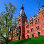 Historic red brick building with tower on a sunny day