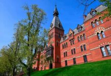 Historic red brick building with tower on a sunny day