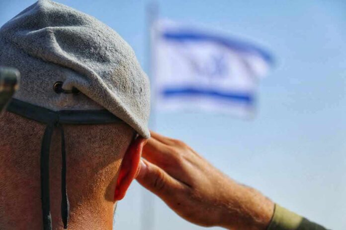 Soldier saluting with a blurred flag in the background