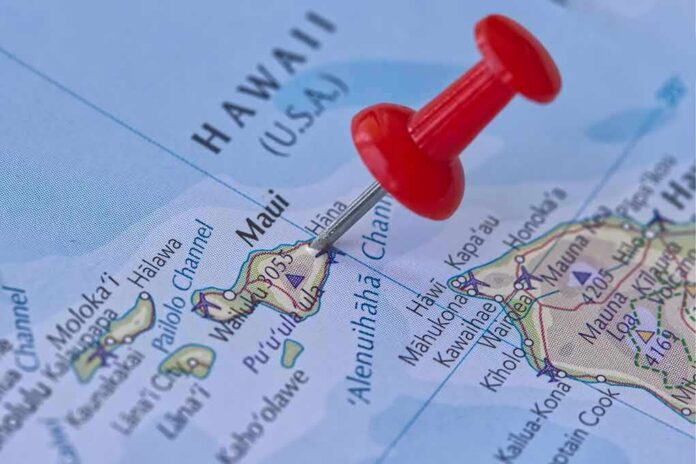 Red pushpin marking Maui on a map of Hawaii