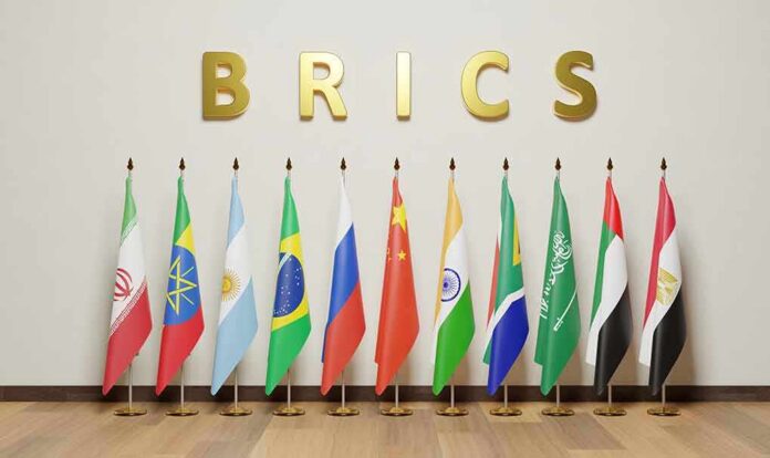BRICS letters above a row of national flags on stands