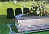 DEA Joins Hunt For Killer Pill casket with floral arrangement at outdoor graveside service