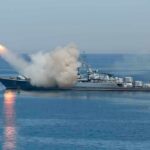 Warship launching a missile at sea