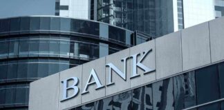 Bank building facade with large sign and glass windows