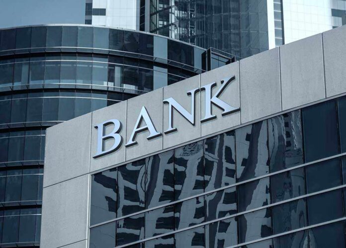 Bank building facade with large sign and glass windows