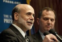 Epstein Heat Freezes Buffett–Gates Pipeline Ben Bernanke speaking at a podium with microphones