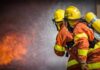 Firefighters spraying water on a blaze