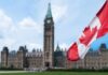 Canadian flag with Parliament building in background