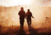 New Starts BANNED – Military Modernization Stuck Two soldiers walking through a smoky field at sunset