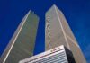 Years Later, Justice Stalls – Key Confessions Axed Twin rectangular skyscrapers rising above a hotel facade against a clear blue sky