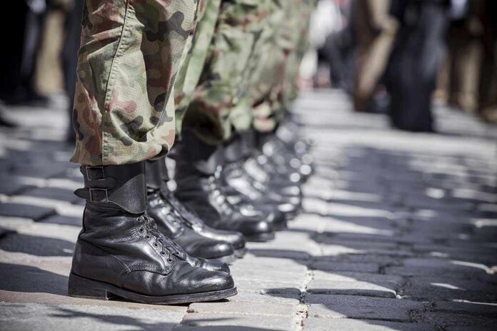 Army,Parade,-,Boots,Close-up Row of soldiers in camouflage pants standing in formation with black boots