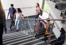 $70K Shock Targets ‘Cheap Labor’ Pipeline Students walking on a school staircase