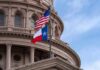 Influencer Claims Leash – Activist Power Play Targets Texas Seat Texas and U.S. flags in front of a capitol building dome