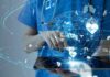 Google’s Racial Double Standard Exposed Healthcare professional using a digital tablet with medical data icons
