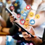 UK Builds Social Media Gatekeepers people using smartphones with social media reactions