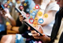 people using smartphones with social media reactions
