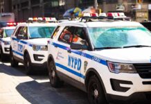 NYPD police SUVs parked in a row on a city street