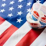 Roll of I Voted stickers on an American flag