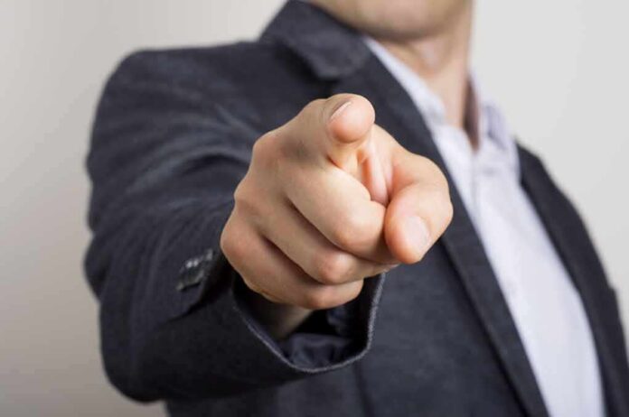 hand pointing directly at the camera