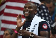 Bet Paid Off – Mayweather Took Everything Floyd Mayweather Jr. smiling and cheering with a towel over his shoulders