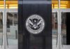 U.S. Department of Homeland Security emblem on building entrance