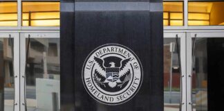 U.S. Department of Homeland Security emblem on building entrance