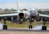Military jet bomber landing on runway