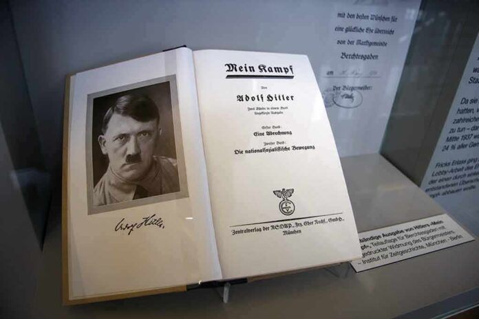 Open historical book on display with portrait and title page