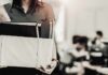 Person carrying a box of office items