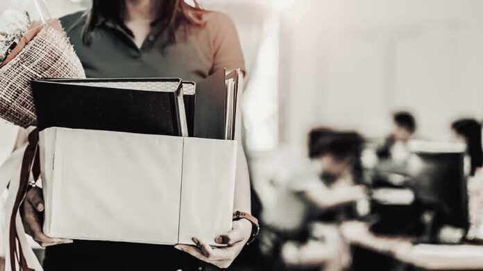 Person carrying a box of office items