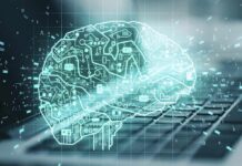 digital brain hologram over a laptop keyboard