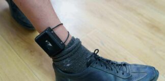 Media Spin Exposed In Tragic Highway Death ankle with electronic monitoring bracelet and black shoe