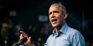 Obama’s Cheesecake Slam Lights Up Trump Rob Nabors speaking at a podium with a microphone