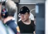 Civilian Network, Combat Chaos – Musk Slows Battlefield Links Elon Musk wearing a black cap in a crowded indoor setting