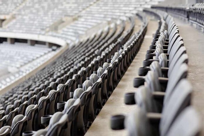 Empty stadium seats in curved rows