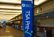 TSA PreCheck sign in an empty airport check-in area