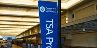 TSA PreCheck sign in an empty airport check-in area