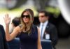 Melania Trump waving while wearing sunglasses outdoors