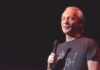 Media Narrative Shaken: Maher’s Trump Reveal comedian holding a microphone on stage